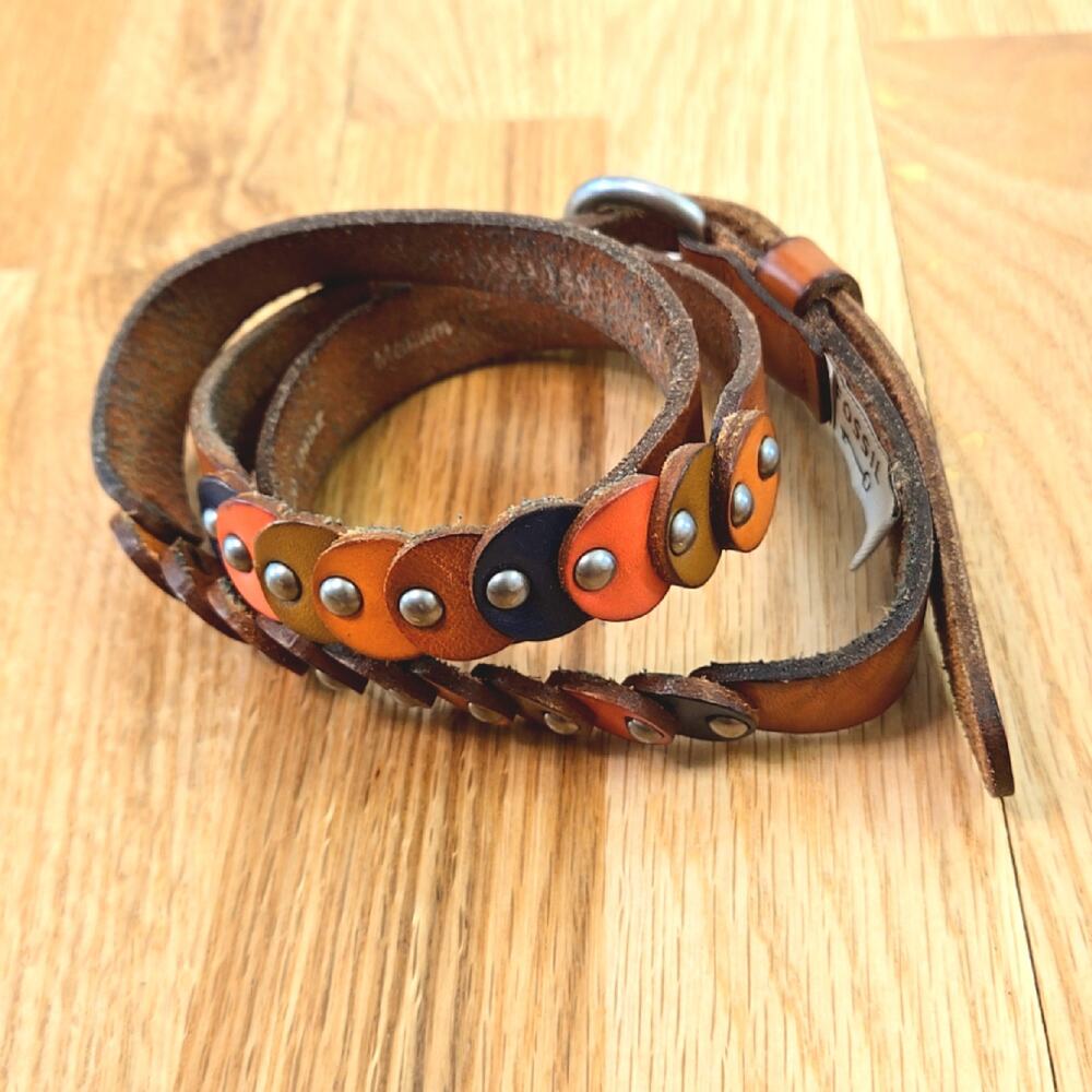 Fossil women's leather belt size med, multi colored with silver toned accents